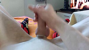 A young 18+ skinny german watches gay porn while masturbating to cumshot.