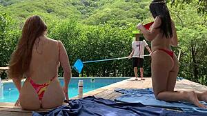 Natasha and Megan Tan Naked While Guy Cleans Pool for Lucky Swim