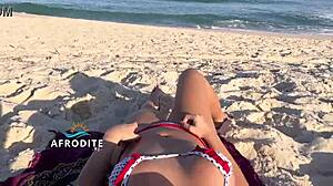 Bent over doggystyle ass masturbation on brazilian beach, vendor watching