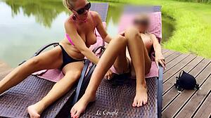 two girlfriends tease each other while masturbating outdoors in the sun