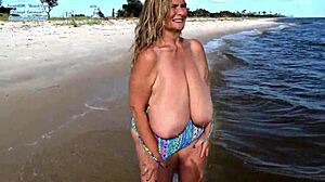 Fat curvy babe in tan-through swimsuit shows huge saggy tits on beach