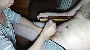 She leaned in close, whispering to just sit back while she worked that cock. Her thong slid aside as cum spilled everywhere.