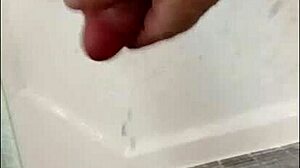 blonde bodybuilder intensely showers muscular cock