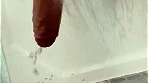 blonde bodybuilder intensely showers muscular cock