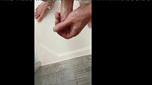 blonde bodybuilder intensely showers muscular cock