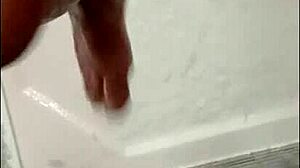 blonde bodybuilder intensely showers muscular cock