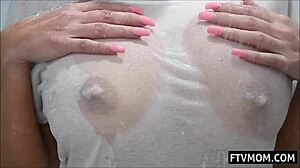 Just watching this big tits milf lathering up in a steamy shower scene.