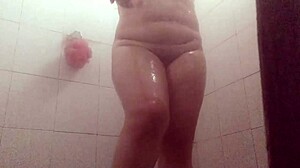 Aventuras voyeur captures gordibuena in shower on hidden cam. She cleans cum off after steamy session!