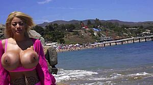 Holy crap! Amber Alena flaunts her massive tits on the beach, turning heads with every bounce!