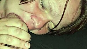 The wife spits on the cock, moans loudly, and deepthroats passionately.