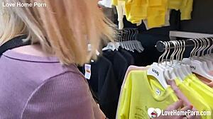 gf sneaks a quick blowjob in changing booth with tattooed guy. cum in mouth seals the deal.