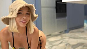 Asian girl coated in oil rides European cock hard