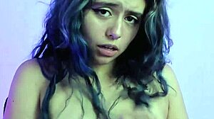 latina in glasses undresses and talks on webcam