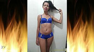 Beautiful brunette in blue lingerie flashes her sexy ass