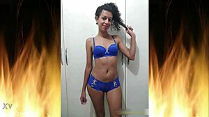 Beautiful brunette in blue lingerie flashes her sexy ass