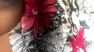 In this homemade scene, the black amateur talks dirty while showing off her small tits and pussy.