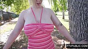 the allure of big natural tits flashing in public, outdoors under the sun, so tempting.