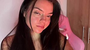Beautiful teenage girl playing video games and pleasuring herself