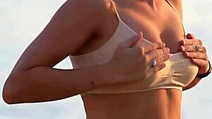 Lady in bra displays softly bouncing boobs in clothed softcore scene