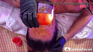 Punishing bound husband with scalding wax humiliation.