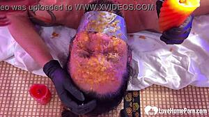 Punishing bound husband with scalding wax humiliation.