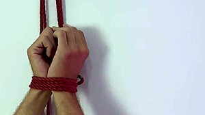 Watch me tease and tickle this submissive boytoy's feet in blindfolded latex domination