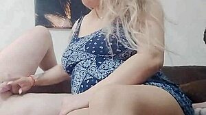 that soft dick turns hard under the blonde's skilled handjob with white nails