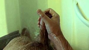 She masturbates in the shower at home