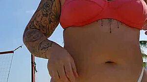 African woman flashing on the beach