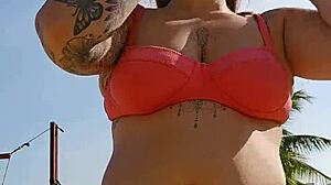 African woman flashing on the beach