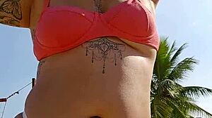 African woman flashing on the beach