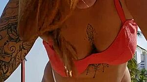 African woman flashing on the beach