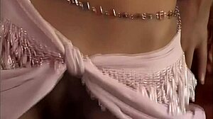 busty brunette katie fey poses topless intensely by the door