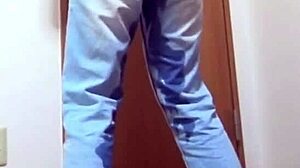 A girl wets her jeans while waiting for the bathroom her brother is using