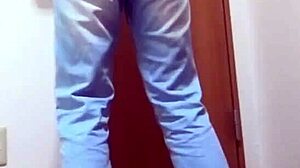 A girl wets her jeans while waiting for the bathroom her brother is using