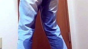 A girl wets her jeans while waiting for the bathroom her brother is using