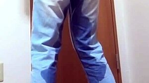 A girl wets her jeans while waiting for the bathroom her brother is using