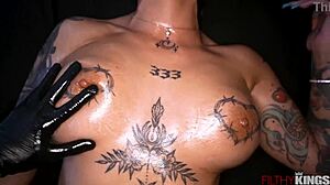 tattooed brunette gets massaged then bent over for anal