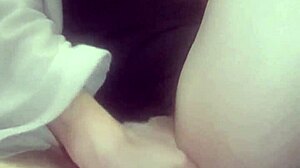 Amateur massages her hot wet pussy with big tits exposed.