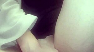 Amateur massages her hot wet pussy with big tits exposed.