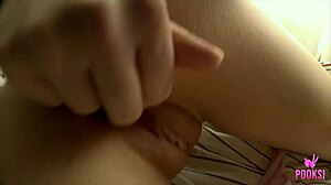 I pull my panties down to rub my clit on the bed