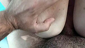 Creampie on giant boobs at summer pool party.