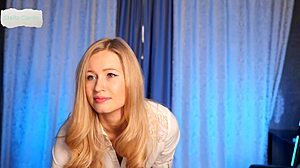 Blonde babe removes white shirt revealing big tits