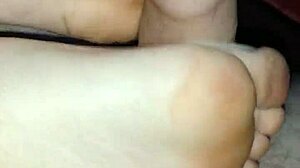 Girlfriend gives homemade bare footjob with big cumshot