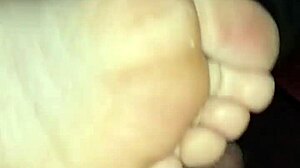 Girlfriend gives homemade bare footjob with big cumshot