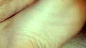 Girlfriend gives homemade bare footjob with big cumshot