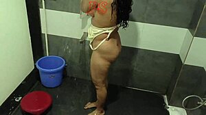 indian desi bhabhi takes a steamy shower with solo fingering.