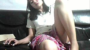 Amateur girl watches softcore porn alone at home.