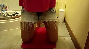 Sexy girl wets herself while masturbating in the toilet