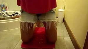 Sexy girl wets herself while masturbating in the toilet